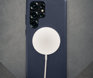 MagSafe charger attached to the Blue Slimline Leather Bumper Case for Galaxy S25 Ultra