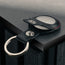 Close up of the press stud clasp on the Black with Red Detail Leather Apple AirTag Holder Keyring