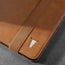 Close up of the leather grain and TORRO bulls head logo on the Tan Leather Case for iPad Air