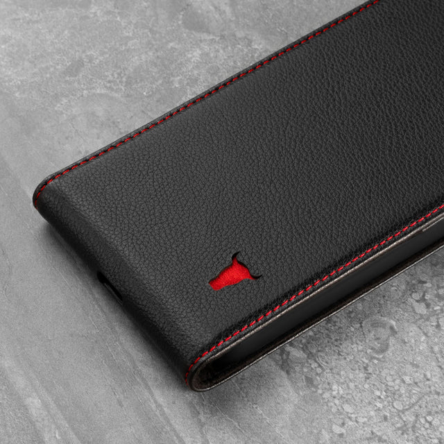 Close up of the Black Leather (with Red Stitching) Flip Case for iPhone 13