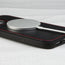 MagSafe charger attached to the Black (with Red Stitching) Leather Bumper Case for iPhone 14 Plus