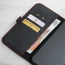 Card and note storage in the Black (with Red Stitching) Leather Folio Case (MagSafe) for iPhone 14 Pro Max