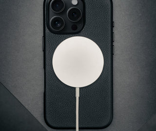 MagSafe charger on the Black Leather Slimline Bumper Case for iPhone 16 Pro