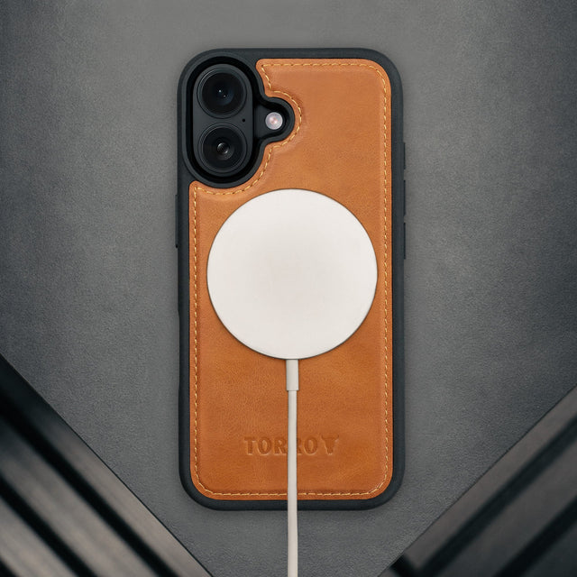 MagSafe charger attached to the Dark Brown Leather Detachable Case for iPhone 17