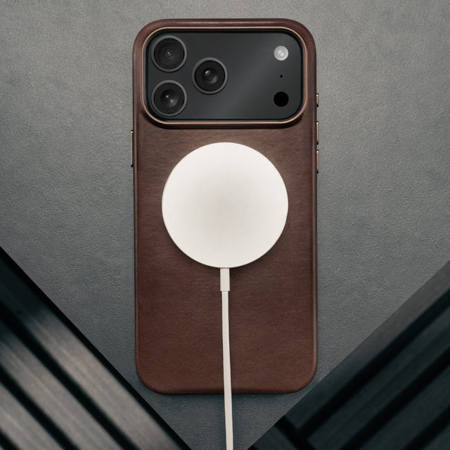 MagSafe charger attached to the Slimline Dark Brown Leather Bumper Case for iPhone 17 Pro