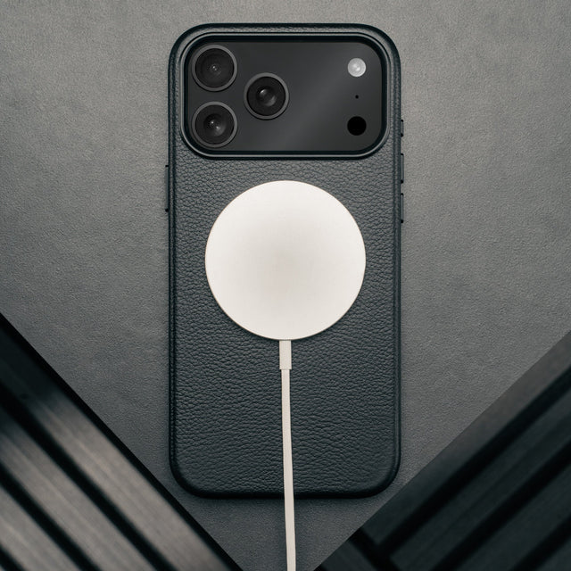 MagSafe charger attached to the Slimline Black Leather Bumper Case for iPhone 17 Pro Max