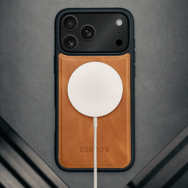 MagSafe charger attached to the Nubuck Blue Detachable Case for iPhone 17 Pro Max