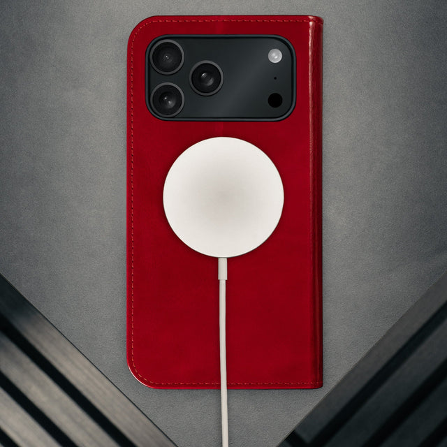 MagSafe charger attached to the Red Leather Case for iPhone 17 Pro