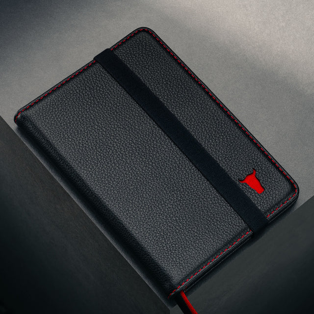 Close up of the TORRO bulls's head logo on the Black Leather (with Red Stitching) Passport Holder